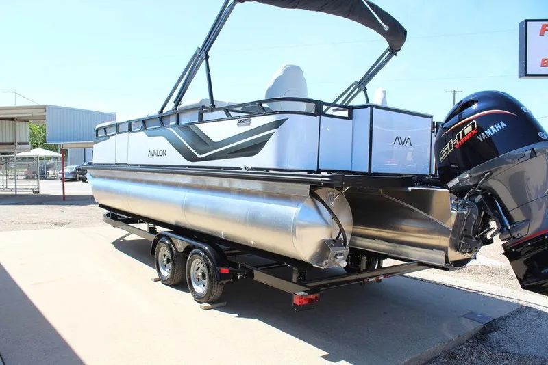Slide: The Image of 2025 Avalon Venture 85 Rear Fish 23 FT pontoon boat on trailer, featuring Yamaha engine. - 10