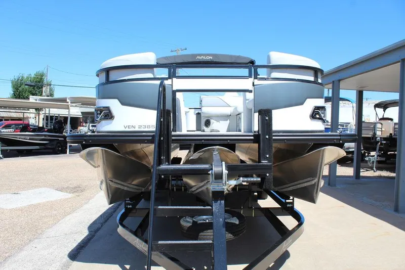 Slide: The Image of 2025 Avalon Venture 85 Rear Fish 23 FT pontoon boat on trailer, rear view. - 12