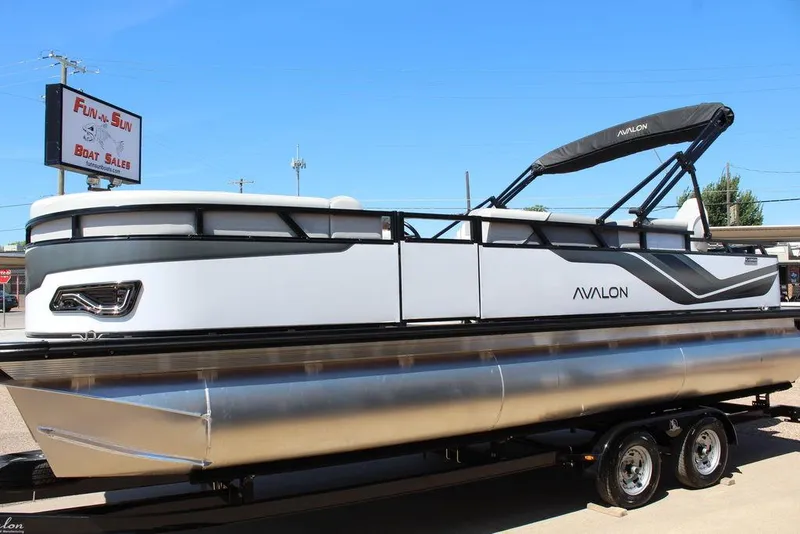 Slide: The Image of 2025 Avalon Venture 85 Rear Fish 23 FT pontoon boat at dealership, on trailer. - 14