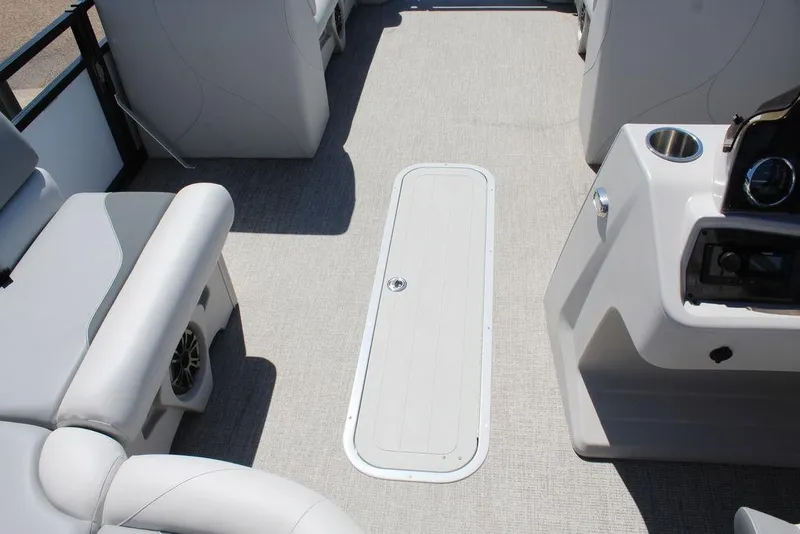 Slide: The Image of 2025 Avalon Venture 85 Rear Fish boat interior with seating and control panel. - 21