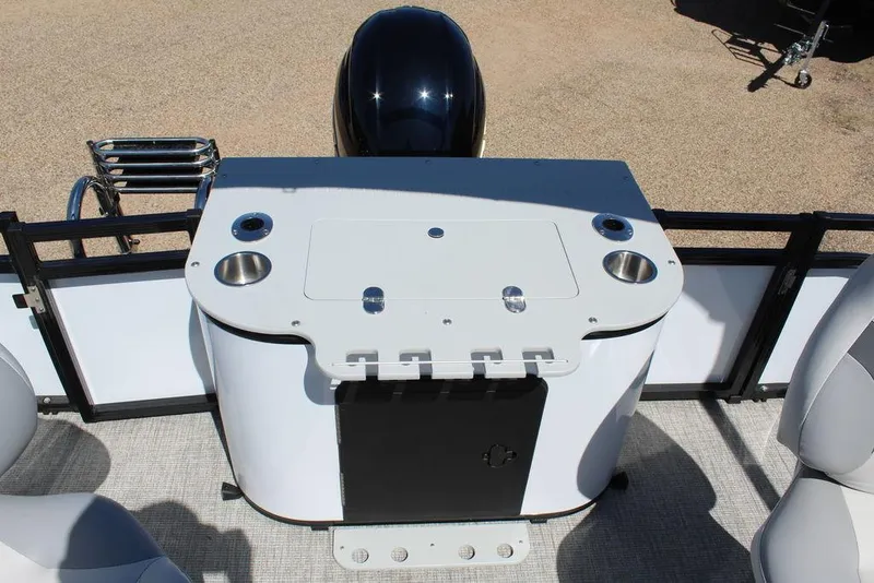 Slide: The Image of 2025 Avalon Venture 85 Rear Fish boat interior with fishing station and cup holders. - 22