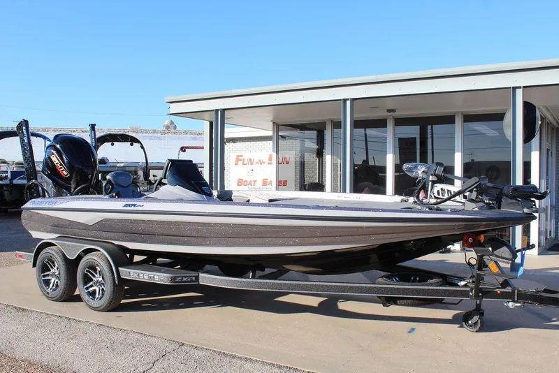 Slide: The Image of 2025 Skeeter ZXR20 boat on trailer outside dealership. - 1