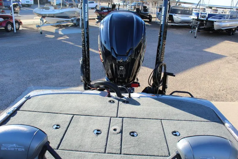 Slide: The Image of 2025 Skeeter ZXR20 boat with powerful outboard motor, displayed in a marina setting. - 10