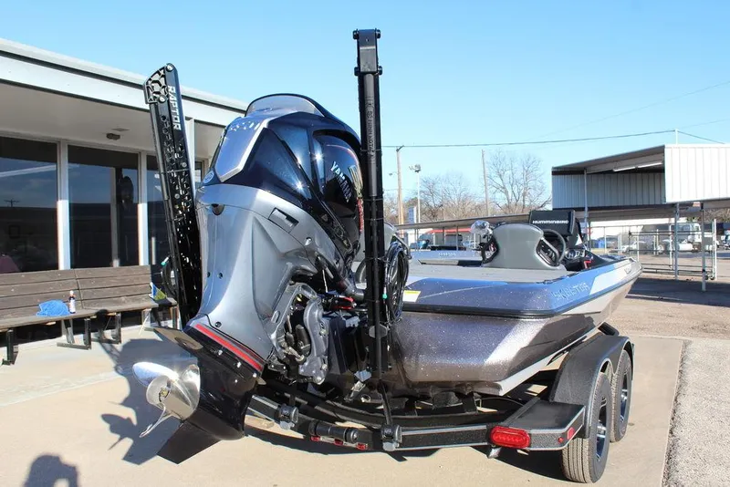 Slide: The Image of 2025 Skeeter ZXR20 boat on trailer, featuring powerful outboard motor and sleek design. - 4
