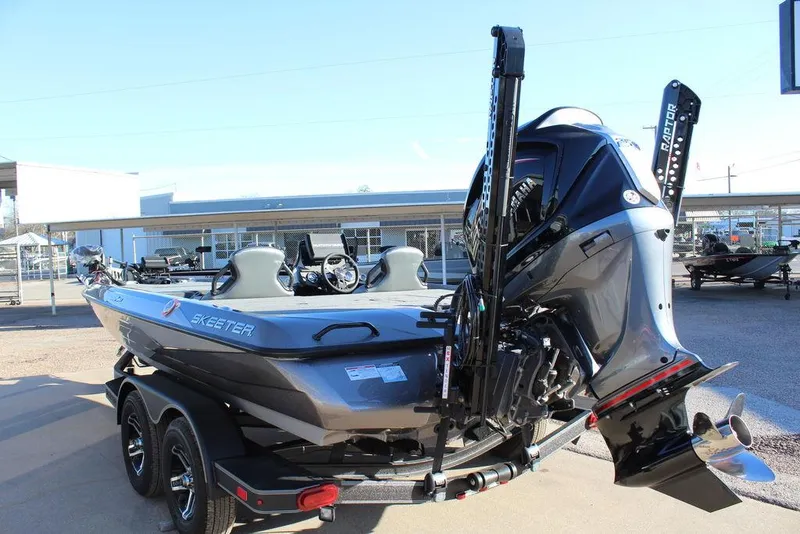 Slide: The Image of 2025 Skeeter ZXR20 boat on trailer, rear view with motor and dual seats. - 5