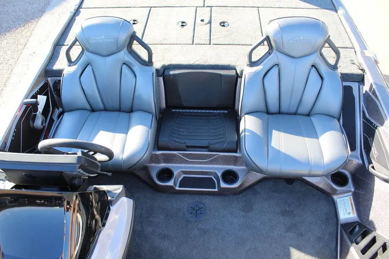 Slide: The Image of 2025 Skeeter ZXR20 boat interior with two gray seats and console. - 9