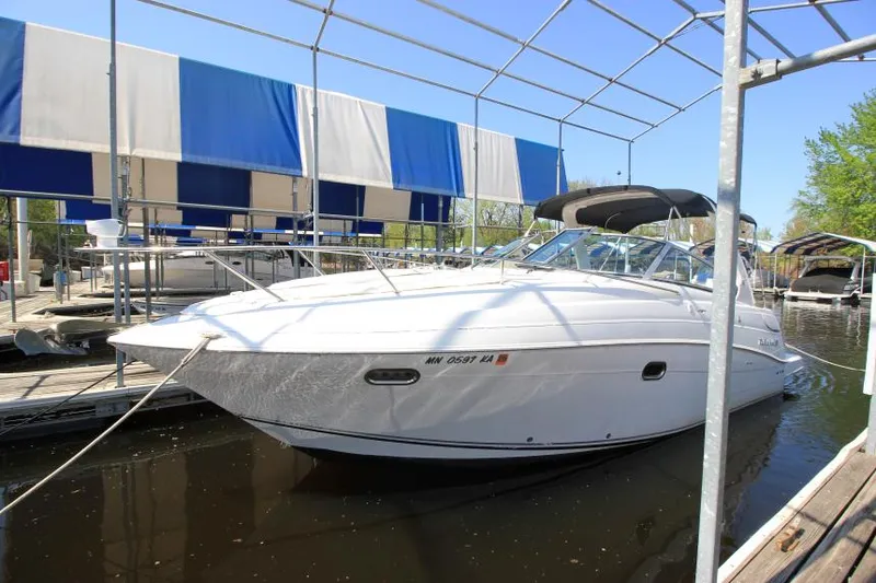The Image of 2004 Four Winns 288 Vista boat docked under a canopy. - 1