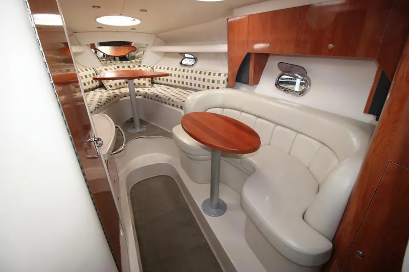 Slide: The Image of Interior of 2004 Four Winns 288 Vista boat with seating and tables. - 17