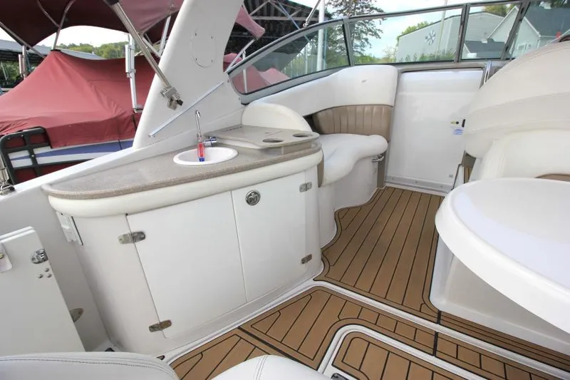 Slide: The Image of 2004 Four Winns 288 Vista boat interior with sink and seating area. - 31