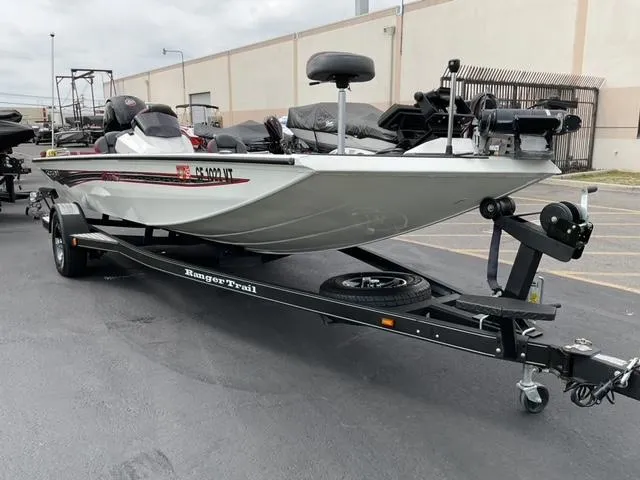 Slide: The Image of 2020 Ranger RT198P fishing boat on trailer in parking lot. - 2