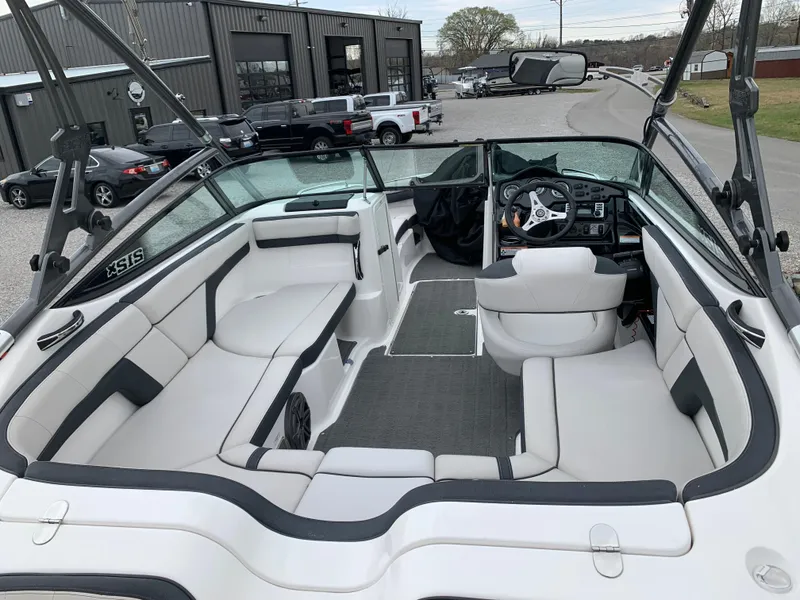 Slide: The Image of 2014 Yamaha Boats 212X interior with sleek seating and modern dashboard. - 5