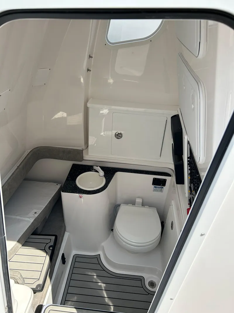 Slide: The Image of 2024 Sea Fox 328 Commander boat interior with toilet and storage. - 11