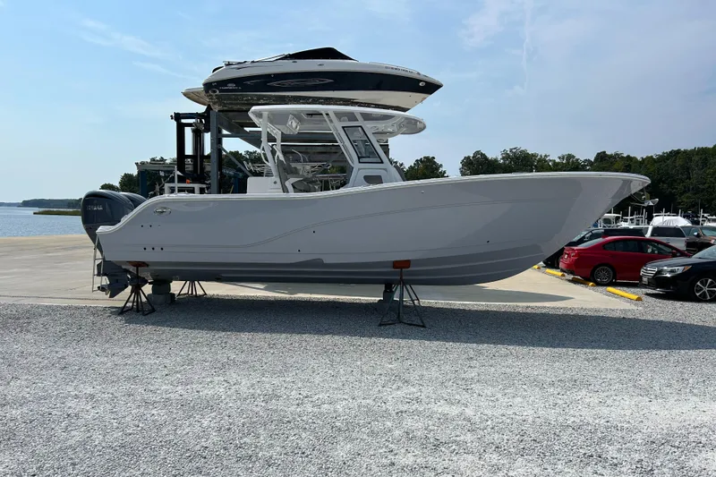 Slide: The Image of 2024 Sea Fox 328 Commander boat on display at a marina. - 5
