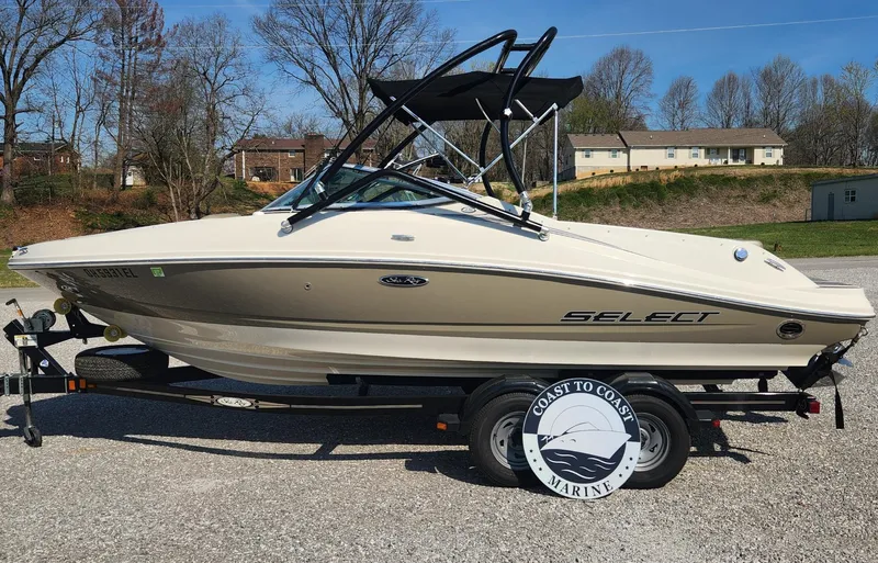 Slide: The Image of 2007 Sea Ray 210 Select boat on trailer, parked outdoors. - 1