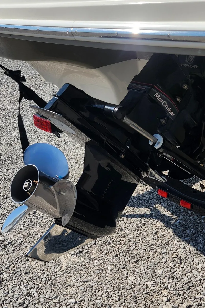 Slide: The Image of 2007 Sea Ray 210 Select boat with MerCruiser outboard motor on gravel surface. - 15