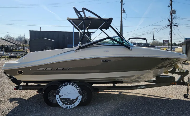 Slide: The Image of 2007 Sea Ray 210 Select boat on trailer, side view, outdoors, sunny day. - 3