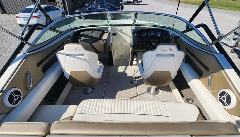 Slide: The Image of 2007 Sea Ray 210 Select boat interior with dual seats and dashboard view. - 7