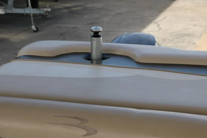 Slide: The Image of 2010 Bennington 2275 GLI boat detail with sleek design and metallic accents. - 27