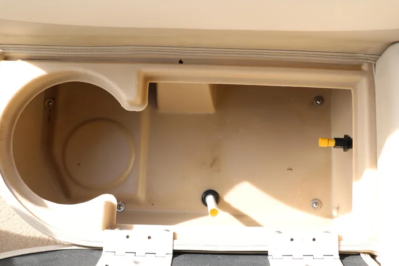 Slide: The Image of Storage compartment of a 2010 Bennington 2275 GLI boat, featuring beige interior. - 28