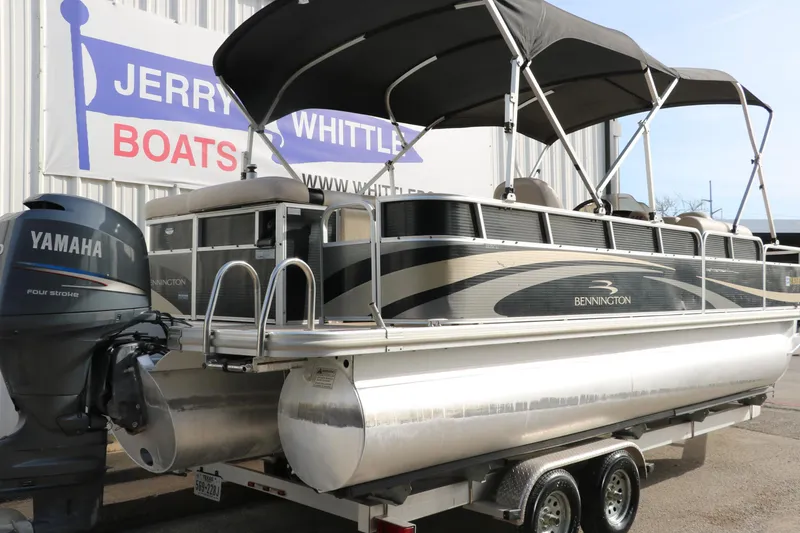 Slide: The Image of 2010 Bennington 2275 GLI pontoon boat with Yamaha engine on trailer at dealership. - 3