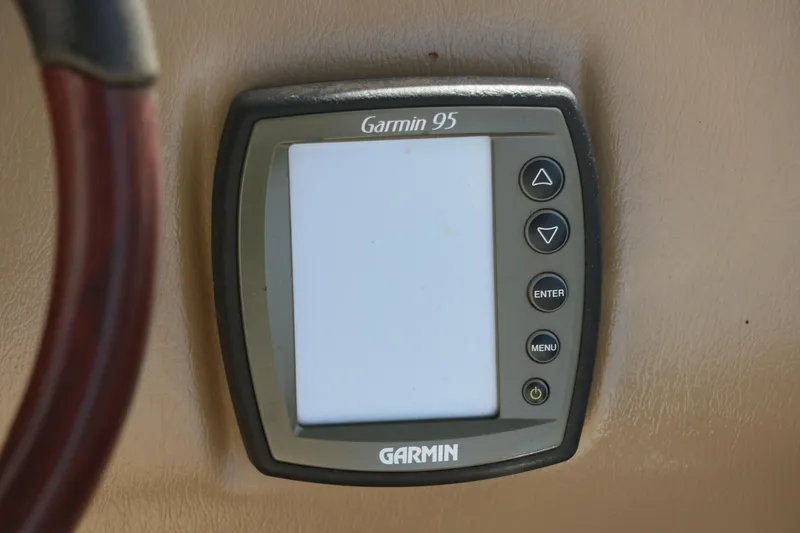 Slide: The Image of Garmin 95 GPS device on 2010 Bennington 2275 GLI boat dashboard. - 33