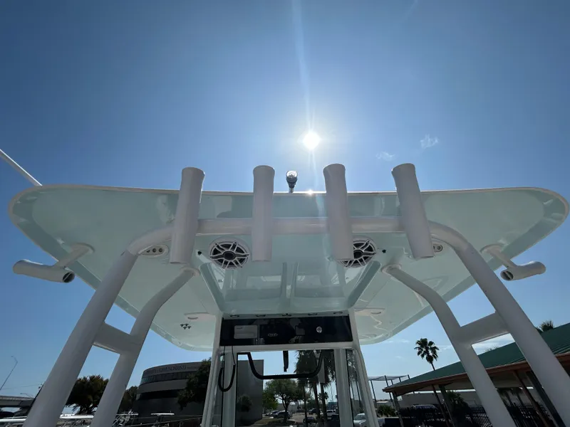 Slide: The Image of 2025 Sea Hunt Gamefish 28 boat with T-top under bright sun. - 10