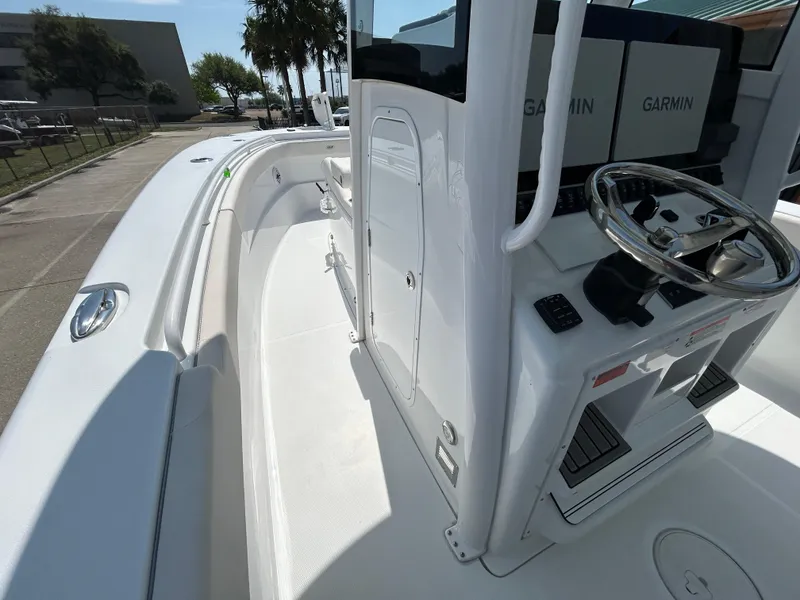 Slide: The Image of 2025 Sea Hunt Gamefish 28 boat interior with Garmin electronics and coffin box. - 14