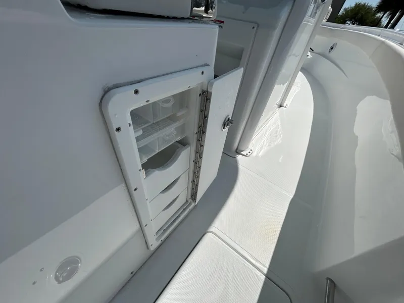 Slide: The Image of 2025 Sea Hunt Gamefish 28 boat interior with storage compartment and coffin box. - 16