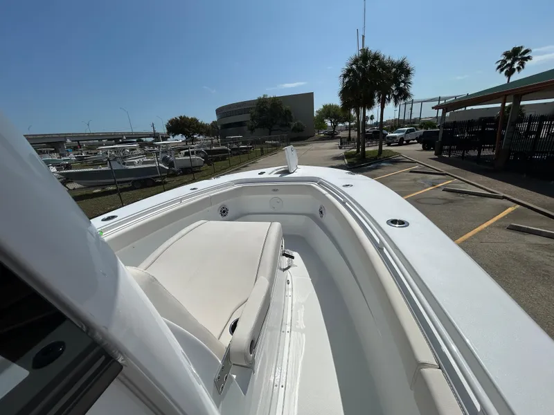Slide: The Image of 2025 Sea Hunt Gamefish 28 with Coffin Box, docked under clear blue sky. - 18