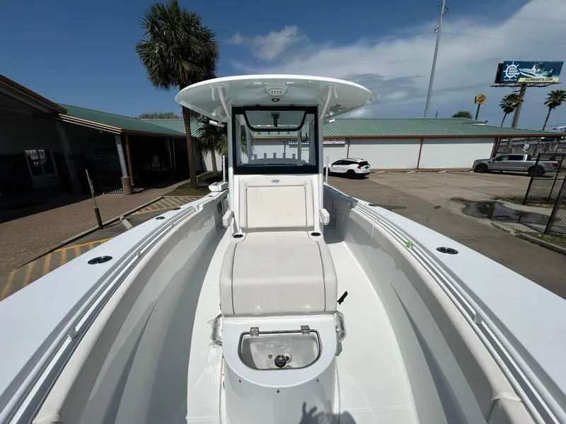 Slide: The Image of 2025 Sea Hunt Gamefish 28 with Coffin Box, sleek design, spacious deck, outdoor setting. - 20
