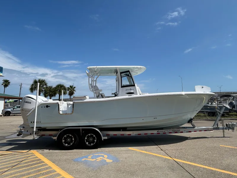 Slide: The Image of 2025 Sea Hunt Gamefish 28 with Coffin Box on trailer, parked outdoors. - 3