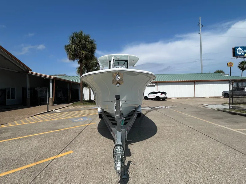 Slide: The Image of 2025 Sea Hunt Gamefish 28 with Coffin Box on trailer, parked outdoors. - 6