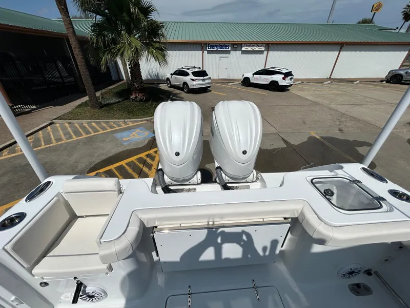 Slide: The Image of 2025 Sea Hunt Gamefish 28 with Coffin Box, featuring dual engines, parked in a lot. - 7