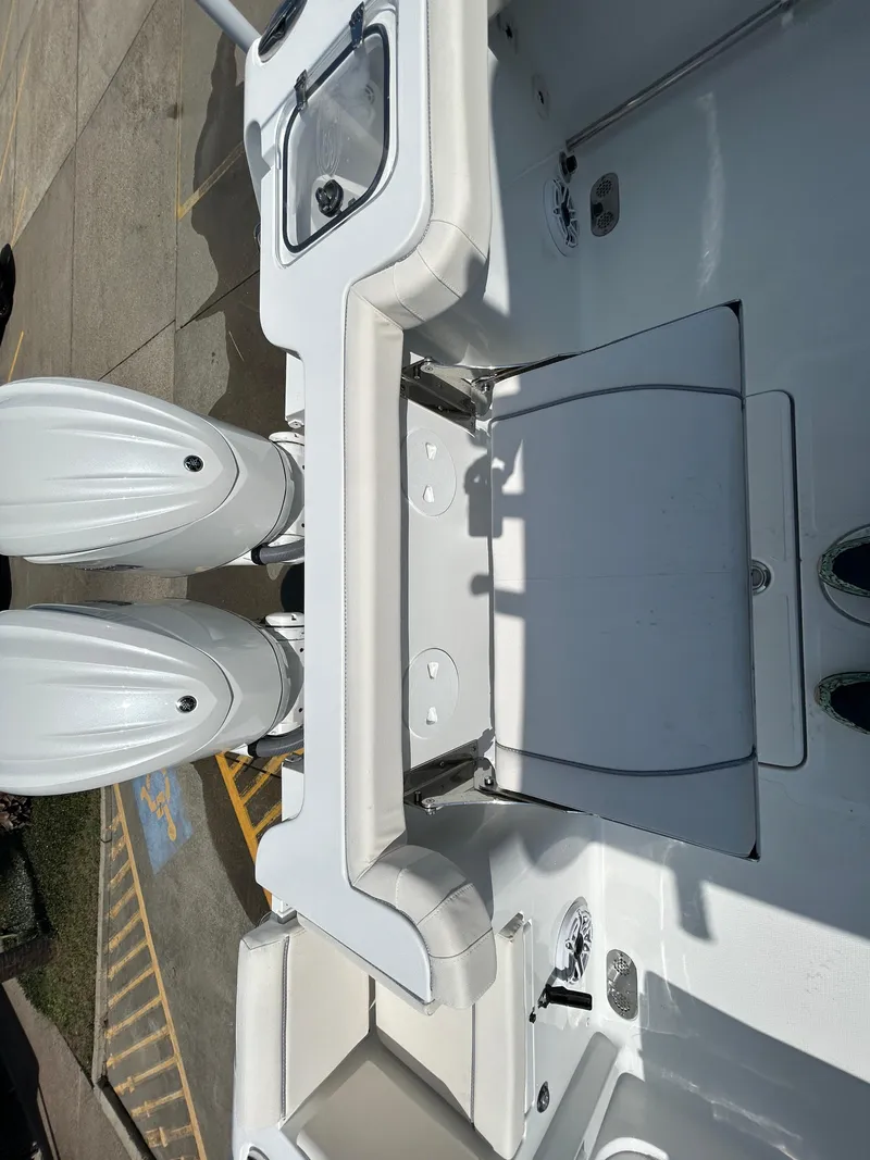 Slide: The Image of 2025 Sea Hunt Gamefish 28 with Coffin Box, featuring dual engines and spacious deck. - 8