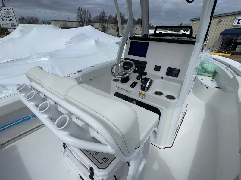 Slide: The Image of 2025 Sea Pro 242 Center Console boat interior with helm and seating. - 13