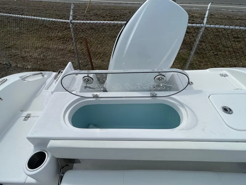 Slide: The Image of 2025 Sea Pro 242 Center Console boat with open livewell and cup holder. - 27