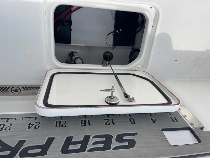 Slide: The Image of 2025 Sea Pro 242 Center Console boat hatch and measuring board. - 36