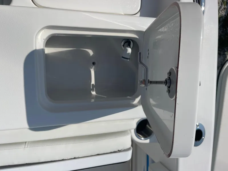 Slide: The Image of Open storage compartment on 2025 Sea Pro 242 Center Console boat. - 37