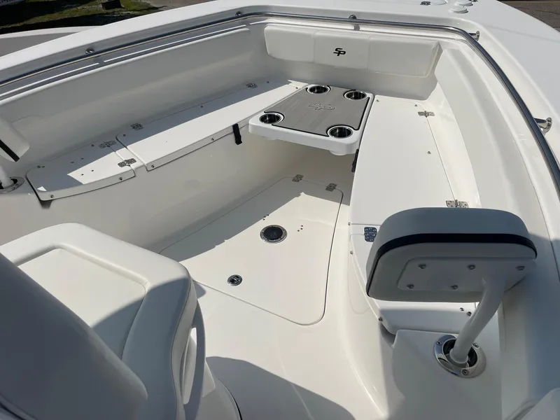 Slide: The Image of 2025 Sea Pro 242 Center Console boat interior with seating and cup holders. - 39