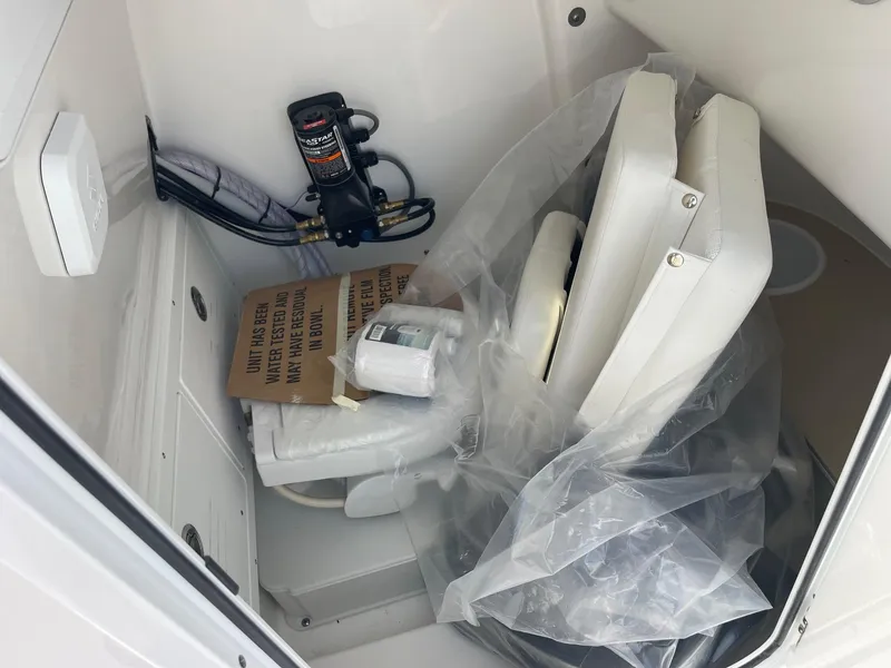 Slide: The Image of Storage compartment of 2025 Sea Pro 242 Center Console boat with equipment and seating. - 40