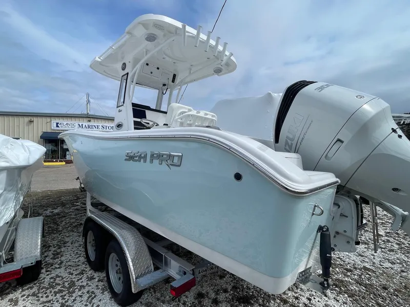 Slide: The Image of 2025 Sea Pro 242 Center Console boat on trailer, displayed outdoors. - 5
