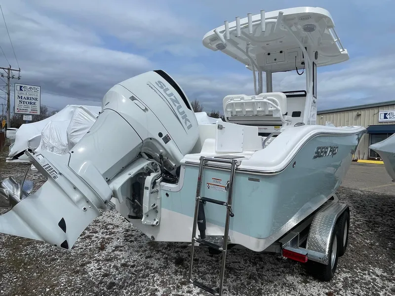 Slide: The Image of 2025 Sea Pro 242 Center Console boat with Suzuki outboard motor on trailer. - 7
