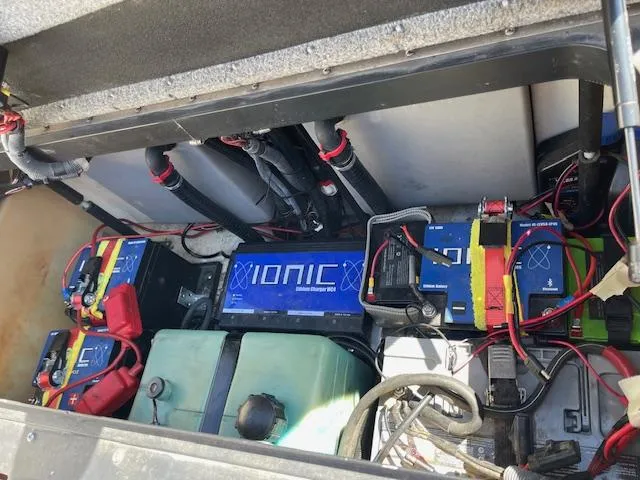 Slide: The Image of 2006 Skeeter 20i boat battery compartment with Ionic lithium batteries and wiring. - 10