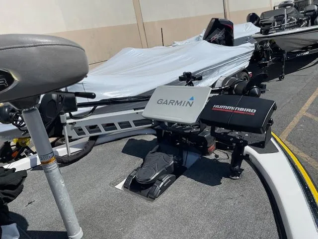 Slide: The Image of 2006 Skeeter 20i boat with Garmin and Humminbird electronics on deck. - 12