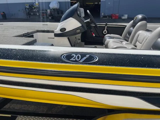 Slide: The Image of 2006 Skeeter 20i boat with yellow and black detailing, interior view. - 7