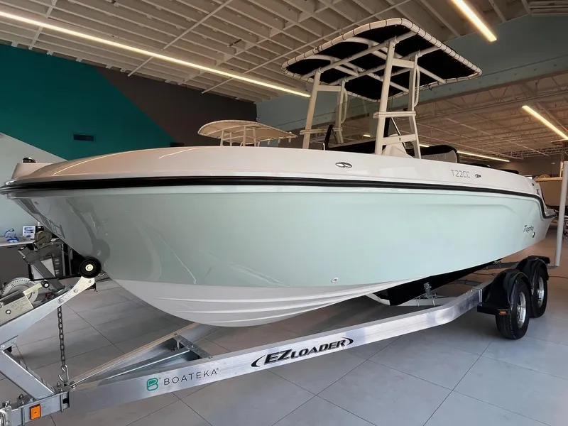 Slide: The Image of 2022 Bayliner Trophy T22CC boat on EZ Loader trailer in showroom. - 2