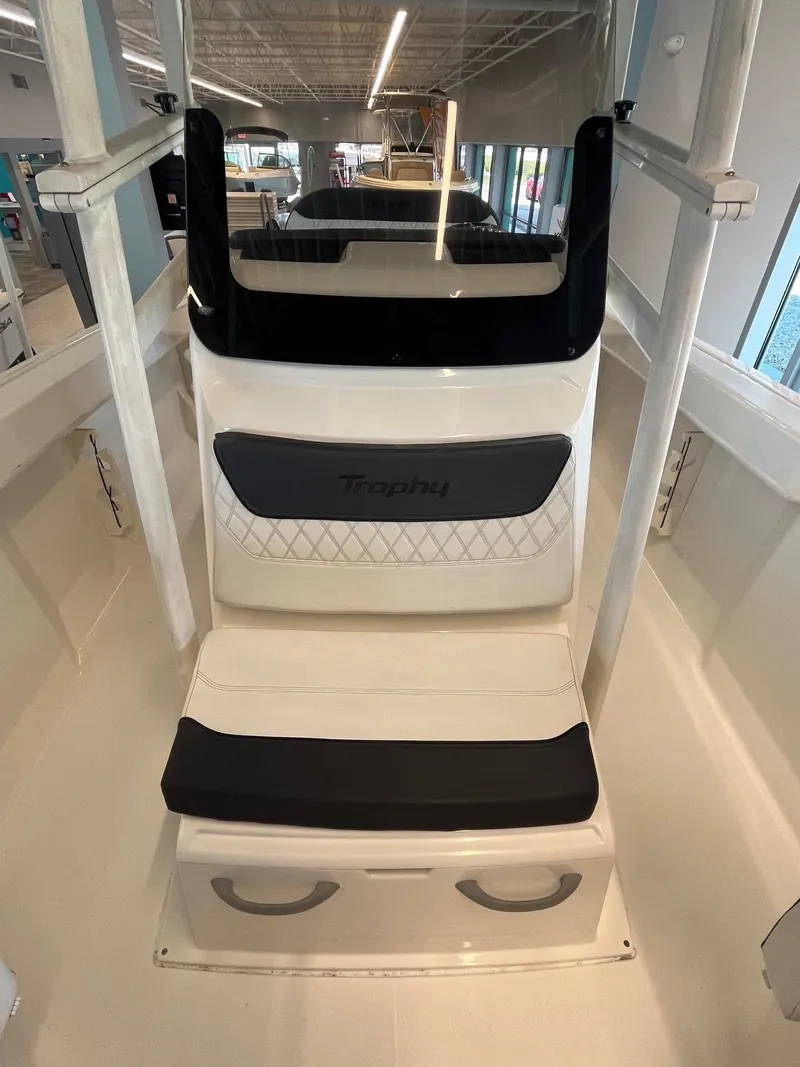 Slide: The Image of 2022 Bayliner Trophy T22CC boat interior with cushioned seating and modern design. - 6