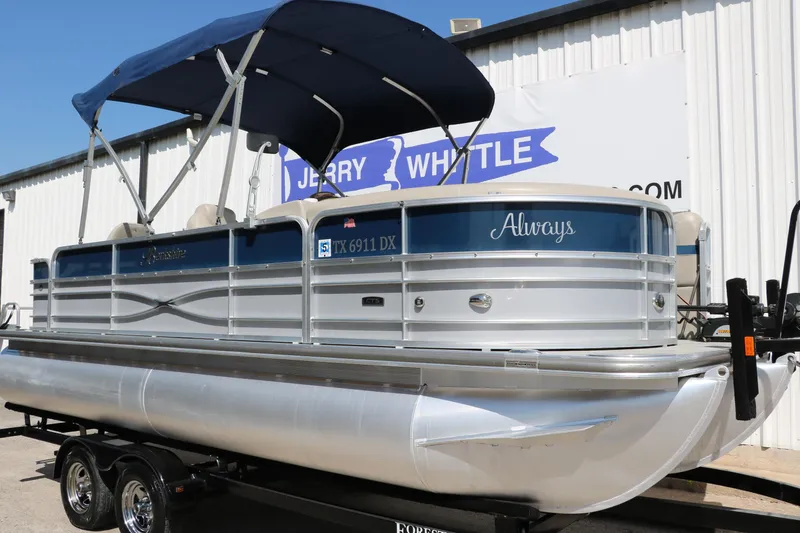 Slide: The Image of 2017 Berkshire 211RFC CTS pontoon boat with blue canopy on trailer. - 11