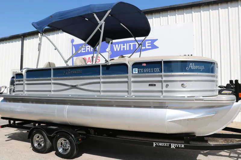 Slide: The Image of 2017 Berkshire 211RFC CTS pontoon boat with blue canopy on trailer. - 12
