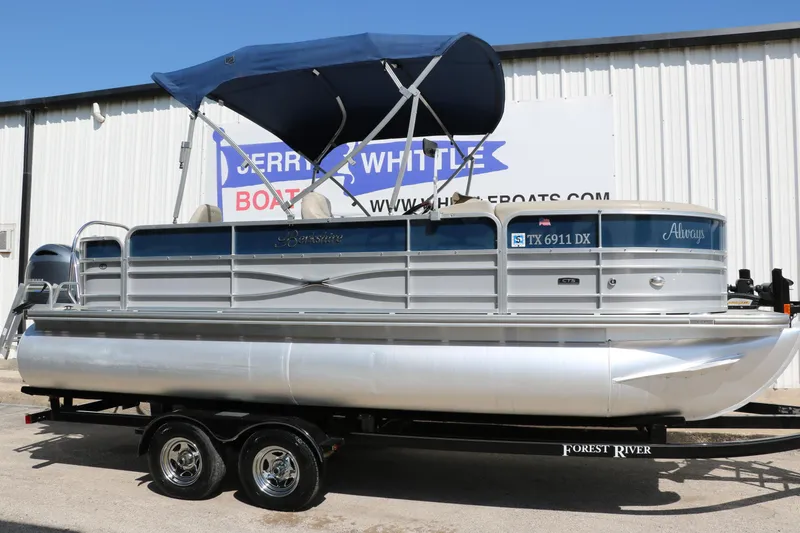Slide: The Image of 2017 Berkshire 211RFC CTS pontoon boat with blue canopy on trailer. - 13